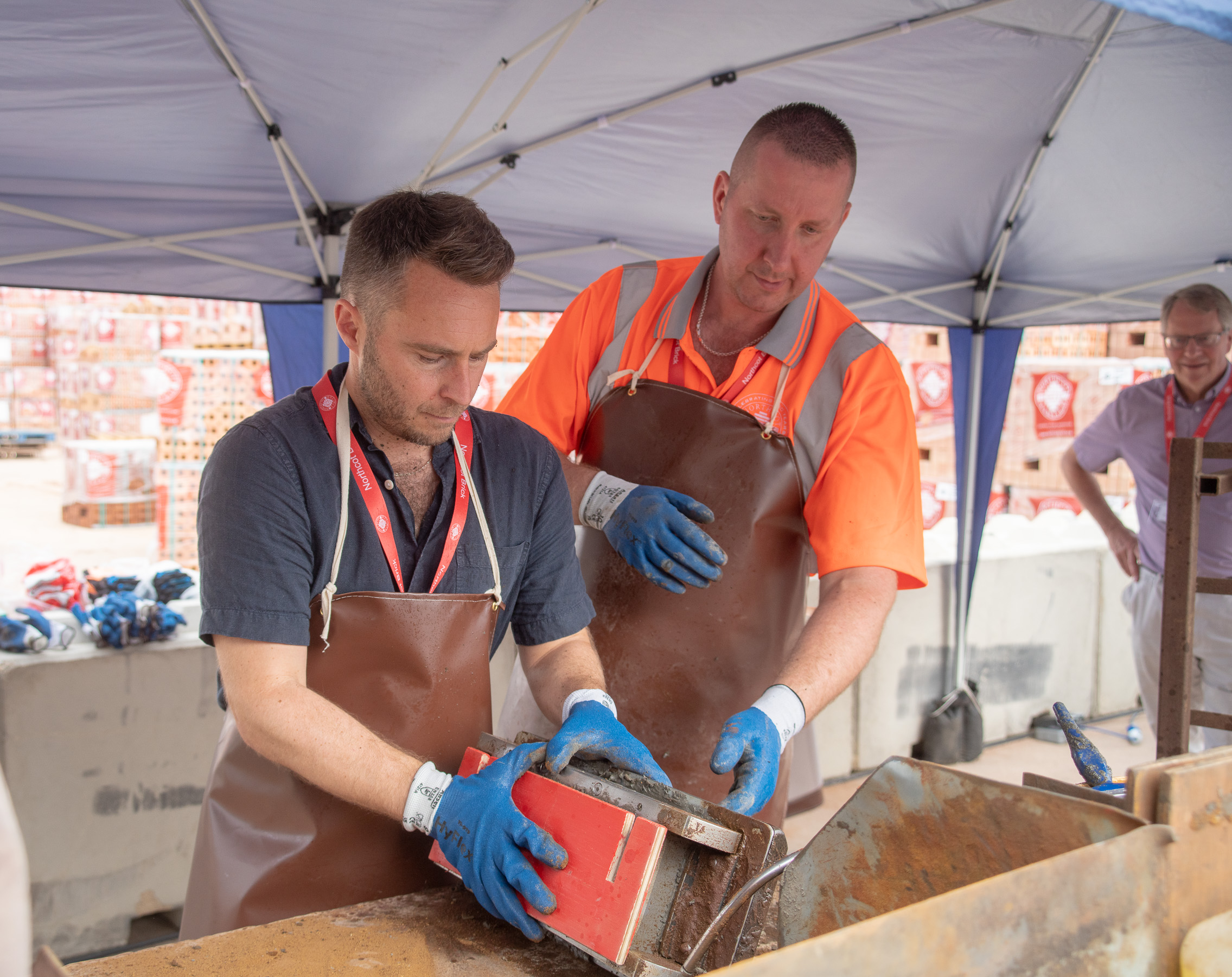 visitors-learn-to-make-bricks-